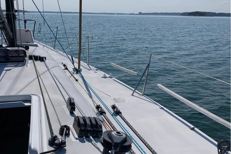 Slide: The Image of Sailboat deck view on water, Tripp 47 model, 1995, with clear blue sky. - 15
