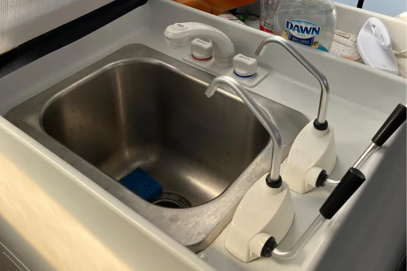 Slide: The Image of Stainless steel sink with dual pumps on a 1995 Tripp 47 boat. - 18