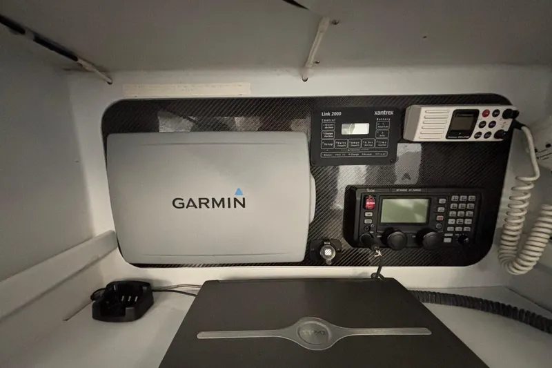 Slide: The Image of Navigation and communication equipment in a 1995 Tripp 47 yacht cabin. - 33
