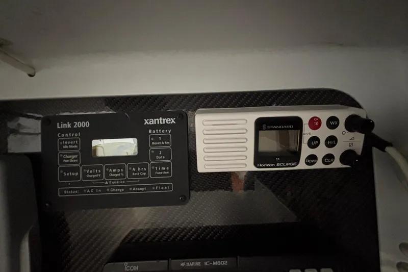 Slide: The Image of Control panels on a 1995 Tripp 47 yacht, featuring Xantrex Link 2000 and Horizon Eclipse. - 36