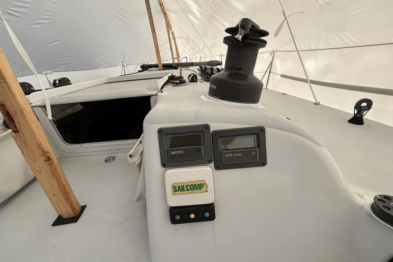 Slide: The Image of Sailboat cockpit of 1995 Tripp 47 with navigation instruments and winch. - 46