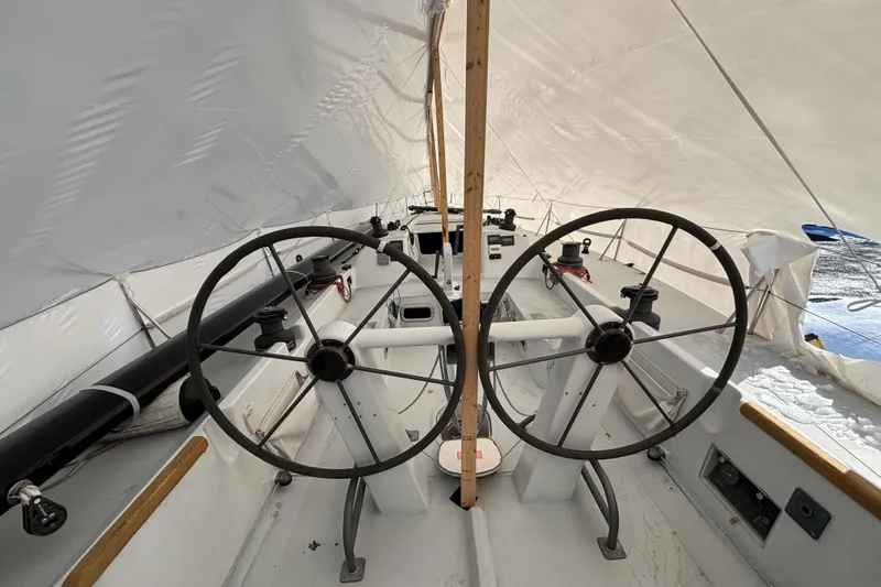 Slide: The Image of Interior view of a 1995 Tripp 47 sailboat with dual steering wheels. - 49