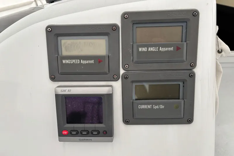 Slide: The Image of Sailing instrument panel on a 1995 Tripp 47 yacht, displaying wind speed, angle, and current. - 57