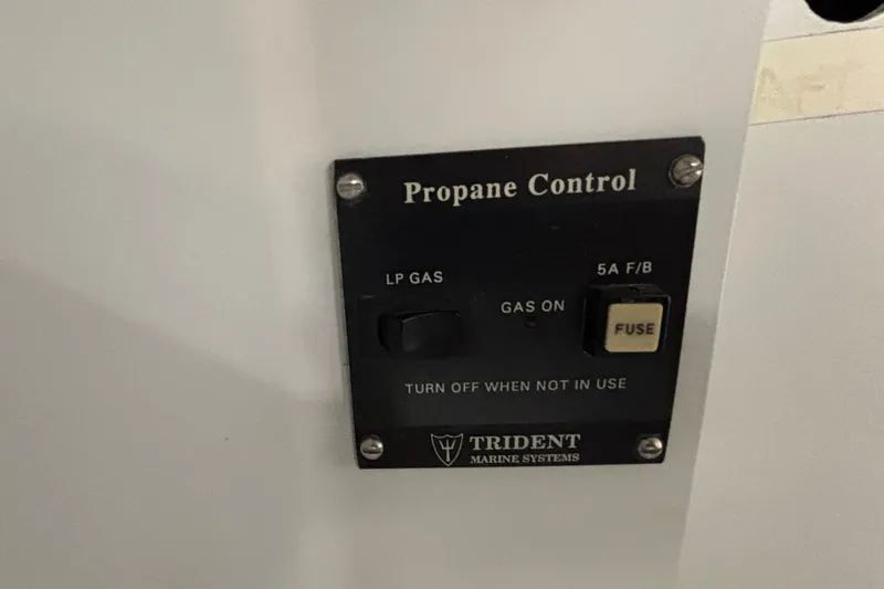 Slide: The Image of Propane control panel by Trident Marine Systems on Tripp 47, 1995 model. - 61