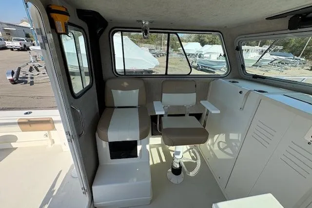 Slide: The Image of 2019 Parker 2520 XLD Sport Cabin interior with seating and storage, showcasing a modern design. - 11