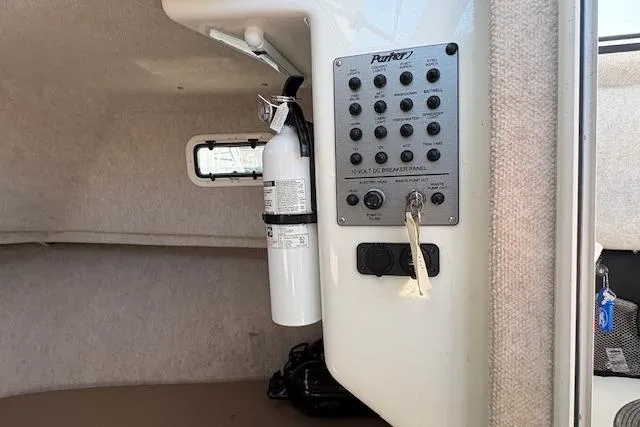 Slide: The Image of 2019 Parker 2520 XLD Sport Cabin interior with control panel and fire extinguisher. - 16