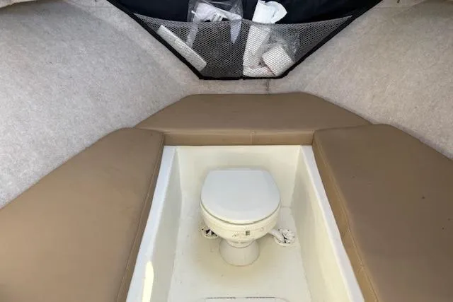 Slide: The Image of 2019 Parker 2520 XLD Sport Cabin interior with toilet and cushioned seating. - 18