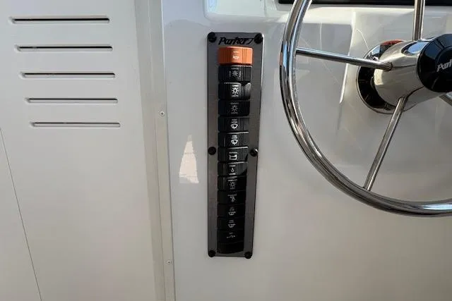 Slide: The Image of Control panel and steering wheel of 2019 Parker 2520 XLD Sport Cabin boat. - 20