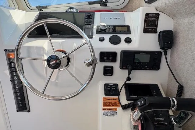 Slide: The Image of Control panel of 2019 Parker 2520 XLD Sport Cabin with Garmin navigation system. - 21