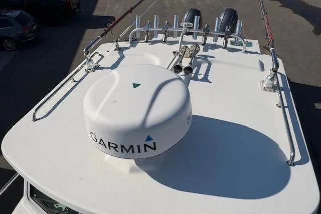 Slide: The Image of 2019 Parker 2520 XLD Sport Cabin boat roof with Garmin radar and fishing rod holders. - 24