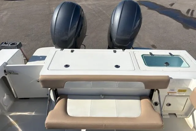 Slide: The Image of 2019 Parker 2520 XLD Sport Cabin boat with dual engines and seating area. - 28