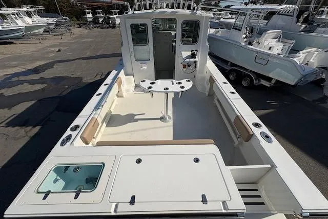 Slide: The Image of 2019 Parker 2520 XLD Sport Cabin boat with spacious deck and fishing amenities. - 29