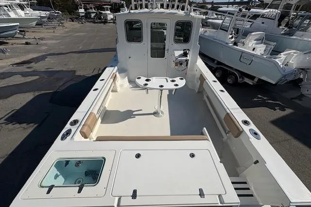 Slide: The Image of 2019 Parker 2520 XLD Sport Cabin boat with spacious deck and fishing amenities. - 6