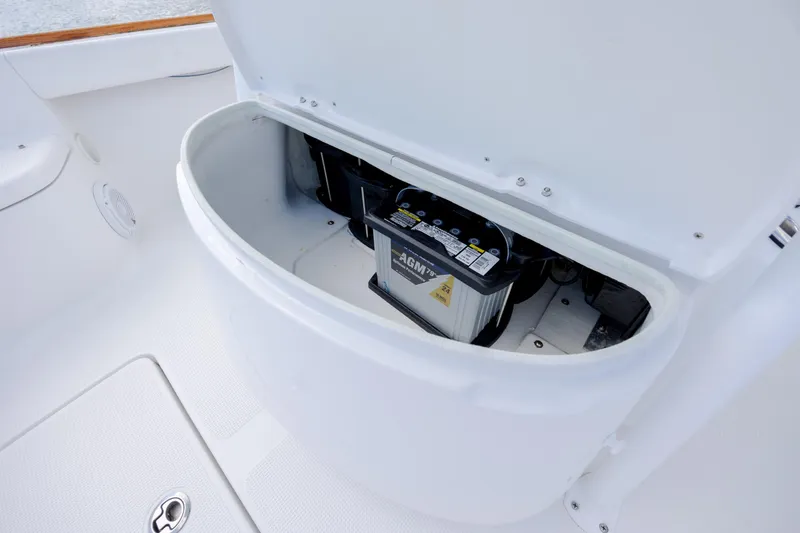 Slide: The Image of Battery compartment of 2017 Chaos 21 Tarpon Bay boat, featuring AGM battery. - 16