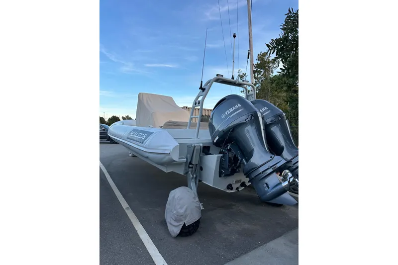 Slide: The Image of 2020 Sealegs 9m Amphibious RIB with Yamaha engines parked on a road. - 10