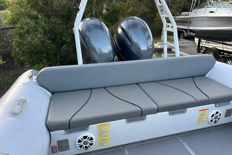 Slide: The Image of 2020 Sealegs 9m Amphibious RIB with dual outboard motors and cushioned seating. - 13