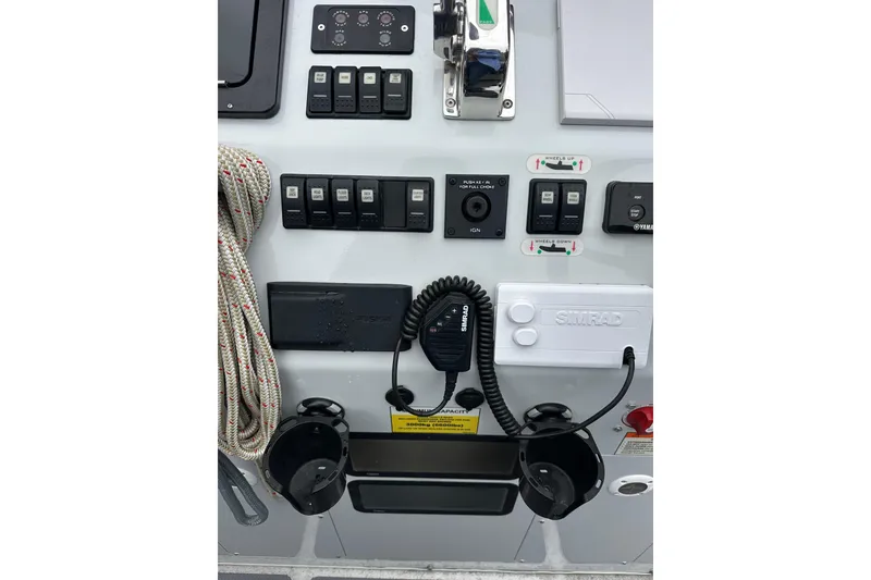 Slide: The Image of Control panel of 2020 Sealegs 9m Amphibious RIB with switches and communication equipment. - 19