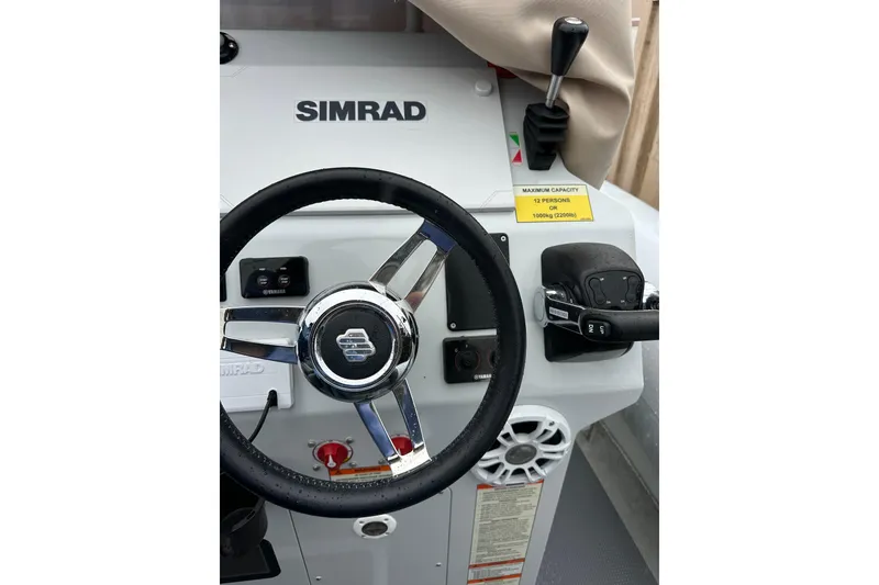 Slide: The Image of Control panel of 2020 Sealegs 9m Amphibious RIB with Simrad steering wheel and controls. - 21