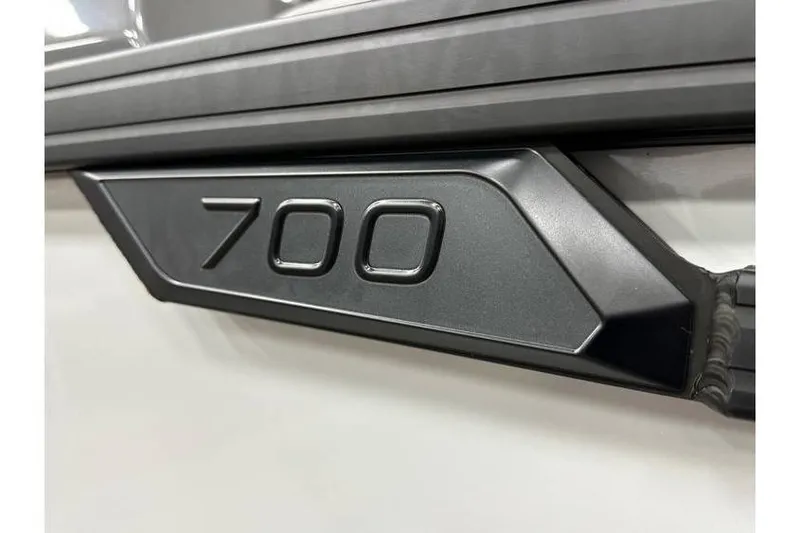 Slide: The Image of Close-up of Evotti 723CS 2026 model with '700' emblem detail. - 15