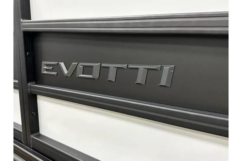 Slide: The Image of Close-up of 2026 Evotti 723CS logo on black metal surface. - 16