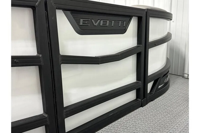 Slide: The Image of Evotti 723CS 2026 model with sleek black and white design in a modern setting. - 17