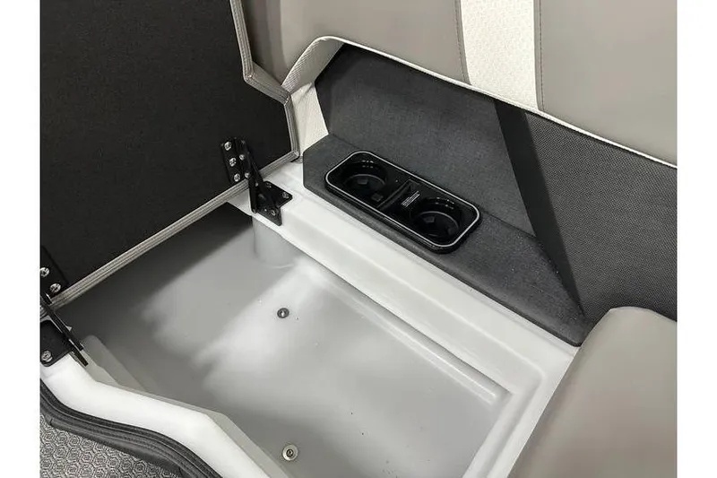 Slide: The Image of Open storage compartment with cup holders in 2026 Evotti 723CS vehicle interior. - 21