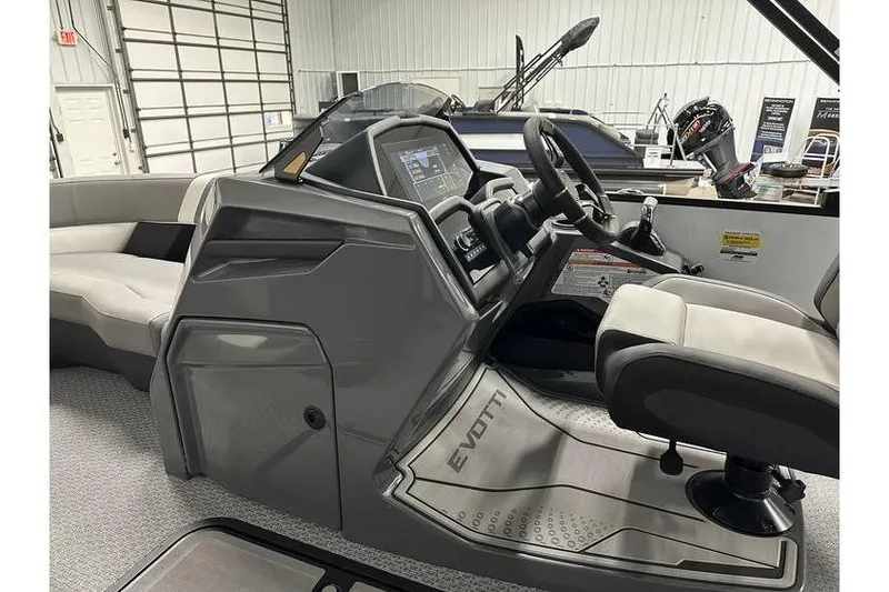 Slide: The Image of Interior of 2026 Evotti 723CS boat, featuring modern helm and seating. - 22