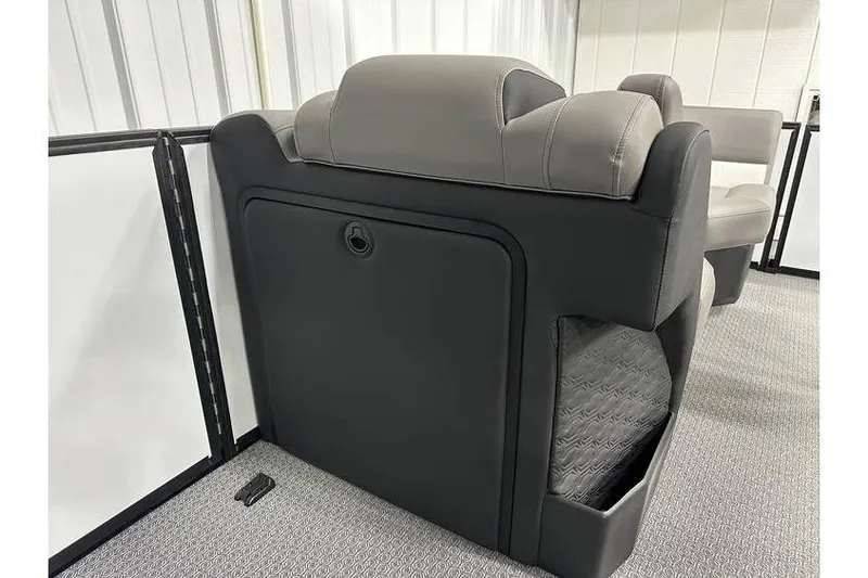 Slide: The Image of 2026 Evotti 723CS boat seating with storage compartment, featuring gray and black upholstery. - 26