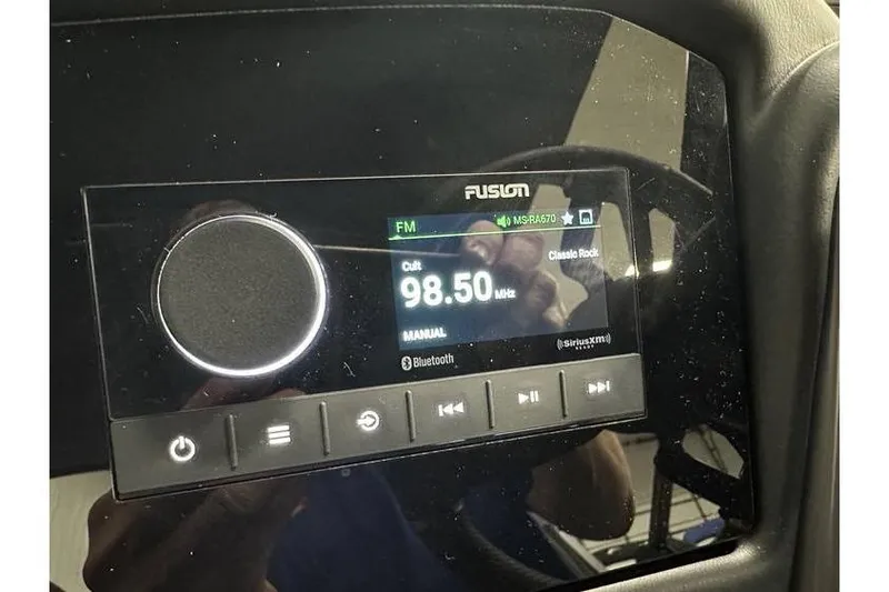 Slide: The Image of Evotti 723CS 2026 car stereo displaying FM radio at 98.50 MHz, classic rock station. - 29