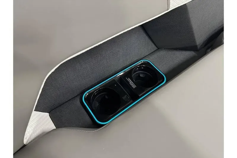 Slide: The Image of Interior of 2026 Evotti 723CS featuring sleek cup holders with blue accents. - 35