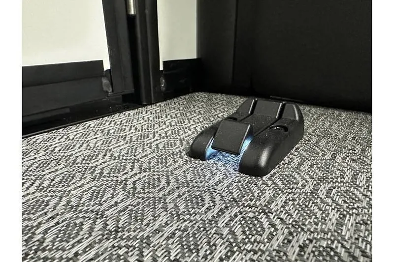 Slide: The Image of Floor latch mechanism in Evotti 723CS, 2026 model, on patterned carpet. - 37