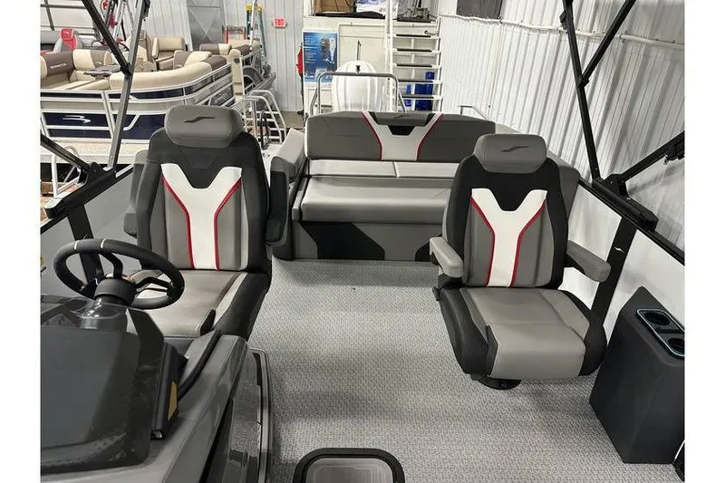 Slide: The Image of 2026 Evotti 723CS boat interior with modern seating and steering wheel in showroom. - 39