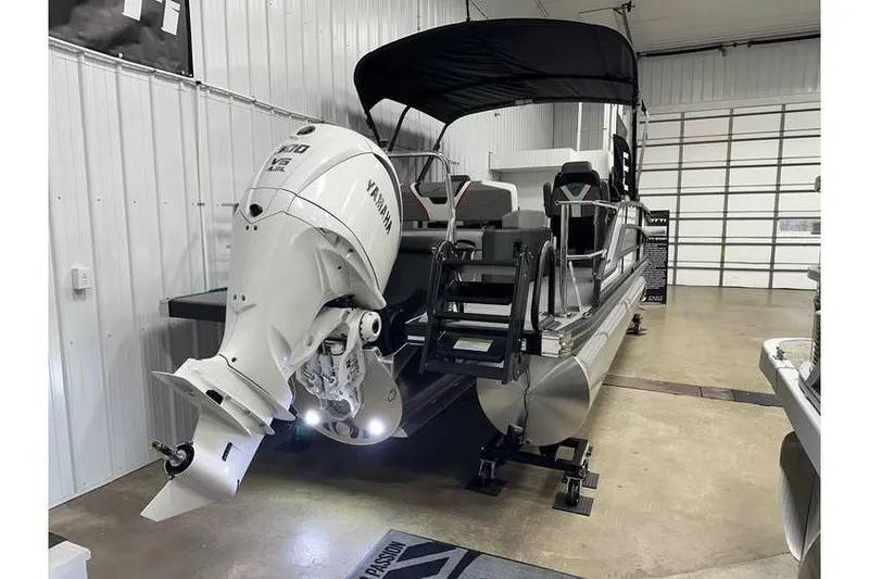 Slide: The Image of 2026 Evotti 723CS pontoon boat with Yamaha outboard motor in a showroom. - 4