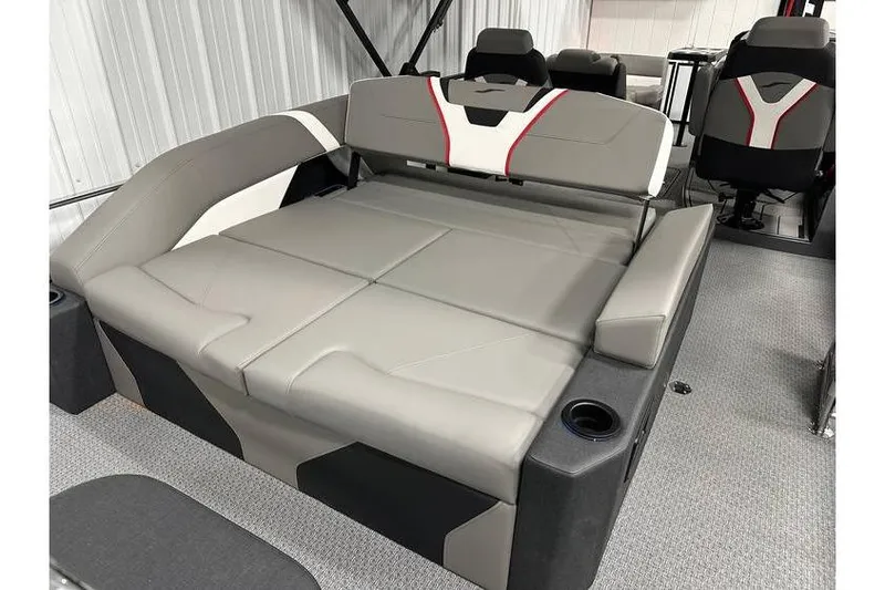 Slide: The Image of 2026 Evotti 723CS boat interior with gray and black seating, cup holders, and modern design. - 43
