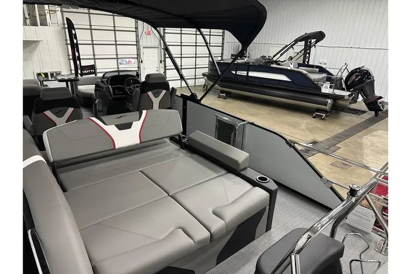 Slide: The Image of 2026 Evotti 723CS boat interior with gray seating and modern design in a showroom. - 60