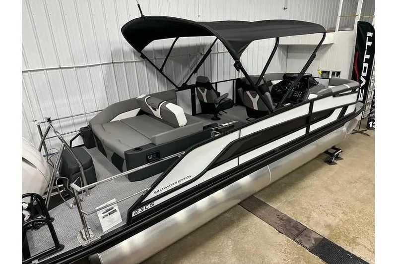 Slide: The Image of 2026 Evotti 723CS pontoon boat with canopy, sleek design, and comfortable seating. - 7