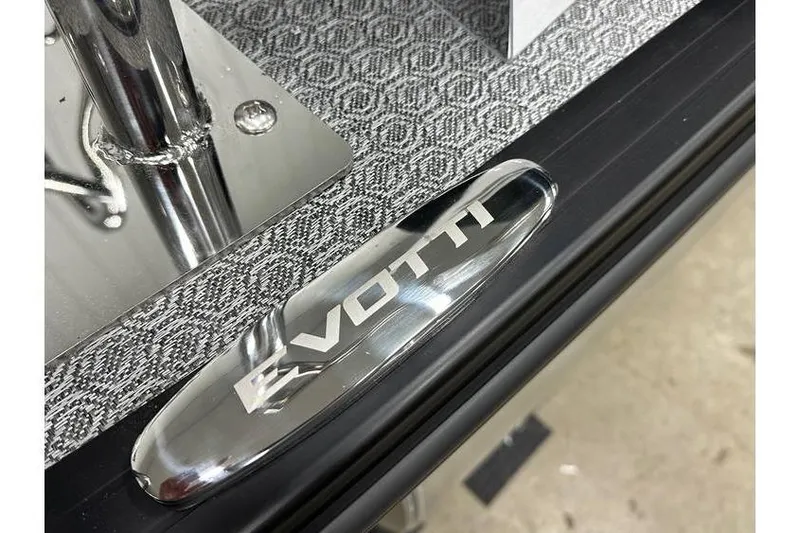 Slide: The Image of Close-up of Evotti 723CS 2026 model with metallic logo and textured surface. - 9