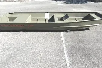 The Image of 2026 Tracker Grizzly 15 Jon boat on pavement, side view. - 0