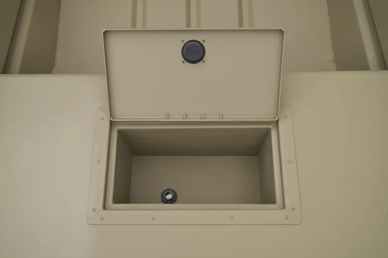 Slide: The Image of Open storage compartment in 2026 Tracker Grizzly 15 Jon boat. - 7