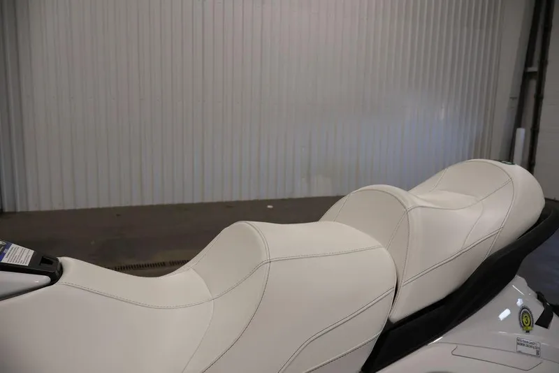Slide: The Image of 2026 Yamaha WaveRunner FX Cruiser SVHO with sleek white seating in a garage setting. - 10