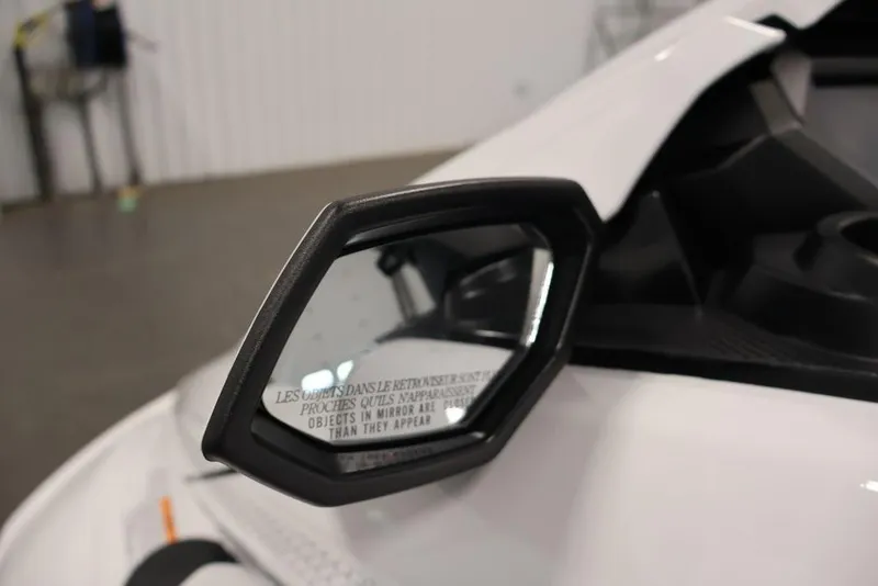 Slide: The Image of Side mirror of 2026 Yamaha WaveRunner FX Cruiser SVHO, showing safety warning text. - 16