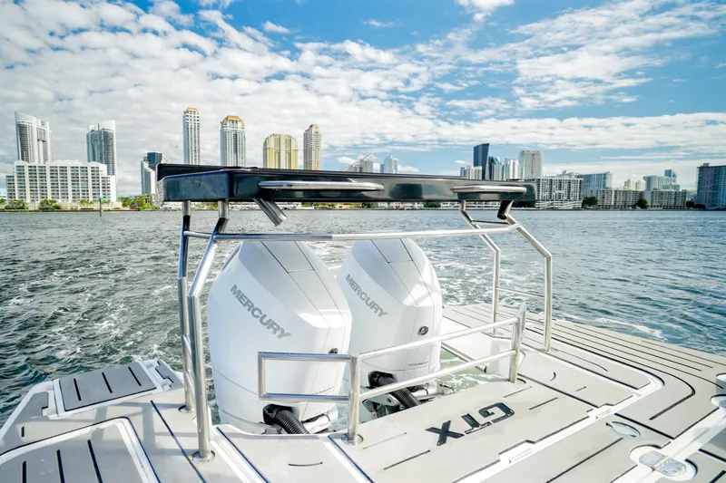 Slide: The Image of Granfort 370 GTX 2026 boat with Mercury engines, city skyline in background. - 16