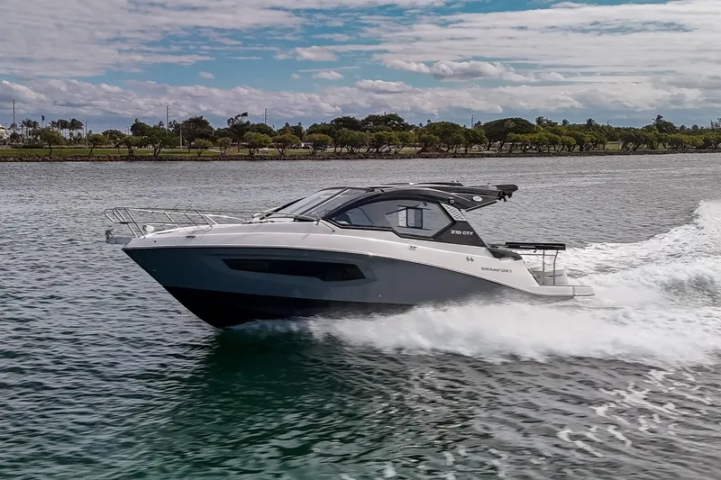 Slide: The Image of 2026 Granfort 370 GTX luxury yacht cruising on a scenic waterway. - 21