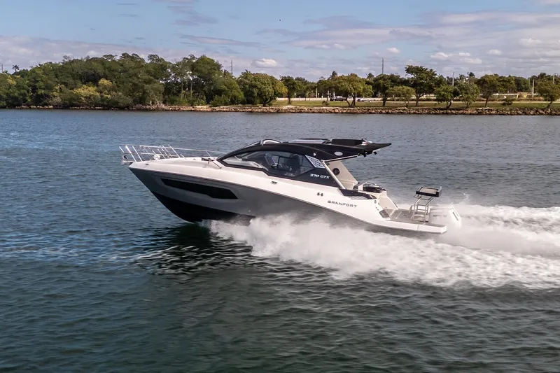 Slide: The Image of 2026 Granfort 370 GTX luxury yacht cruising on a scenic waterway. - 22