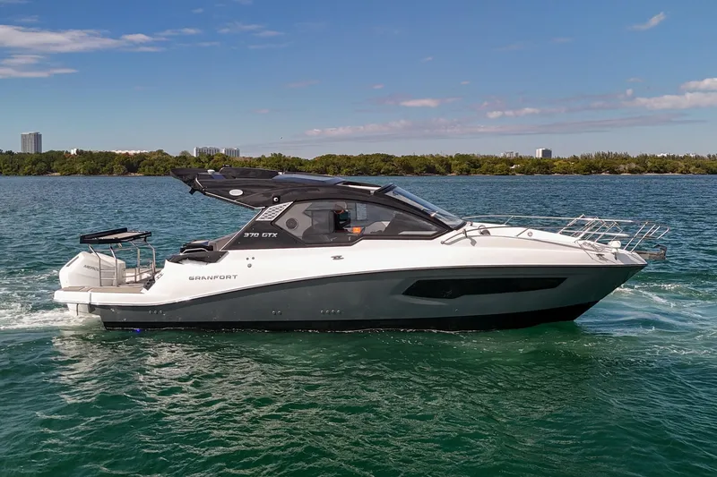 Slide: The Image of 2026 Granfort 370 GTX luxury yacht cruising on open water. - 25
