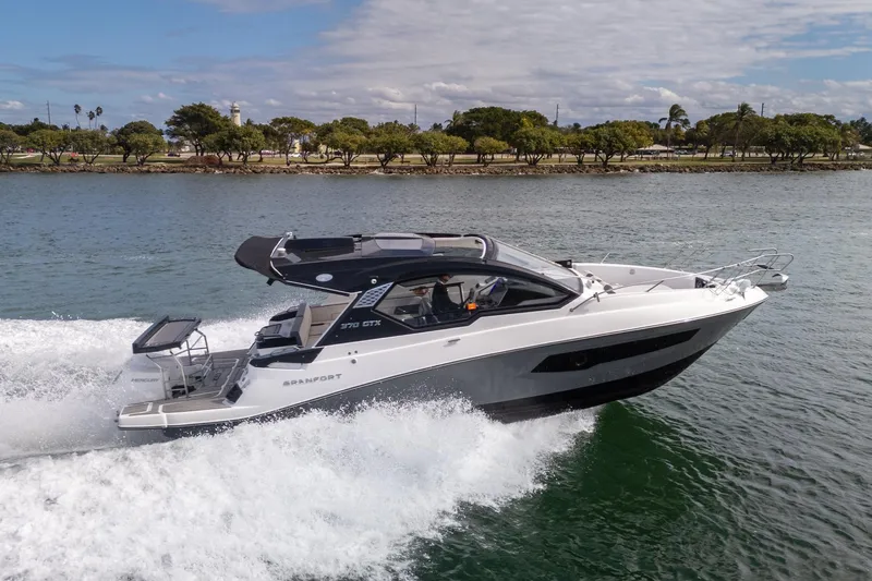 Slide: The Image of 2026 Granfort 370 GTX luxury yacht cruising on a scenic waterway. - 26