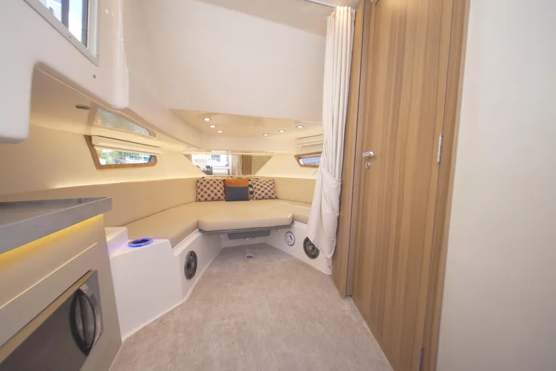 Slide: The Image of Luxurious interior of 2026 Granfort 370 GTX yacht with modern seating and wood accents. - 6