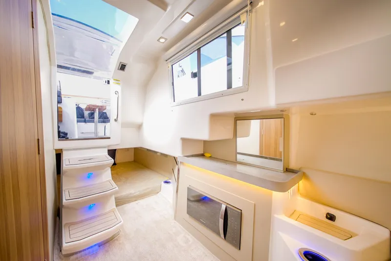 Slide: The Image of Interior of 2026 Granfort 370 GTX yacht, featuring modern design and ambient lighting. - 7