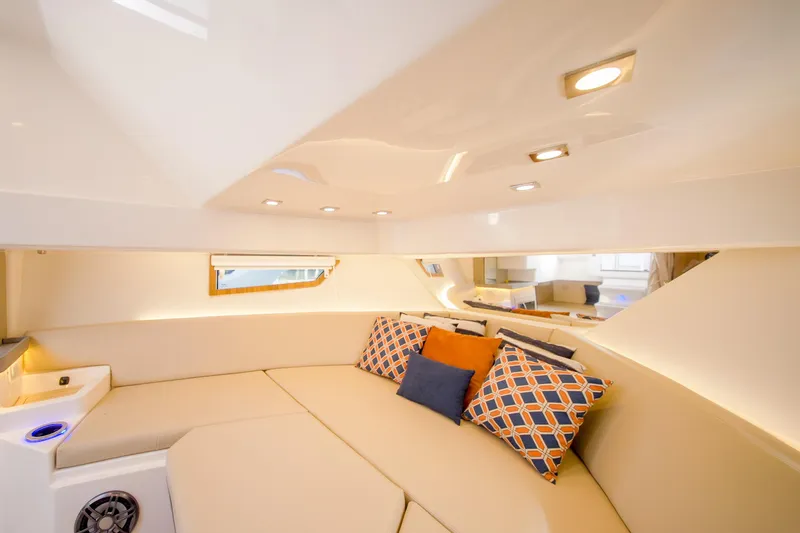 Slide: The Image of Luxurious interior of 2026 Granfort 370 GTX yacht with plush seating and decorative cushions. - 9