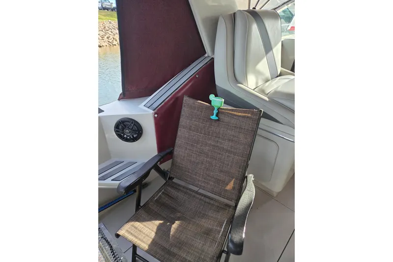 Slide: The Image of 1988 Wellcraft 3200 St. Tropez boat interior with chair and cup holder. - 17